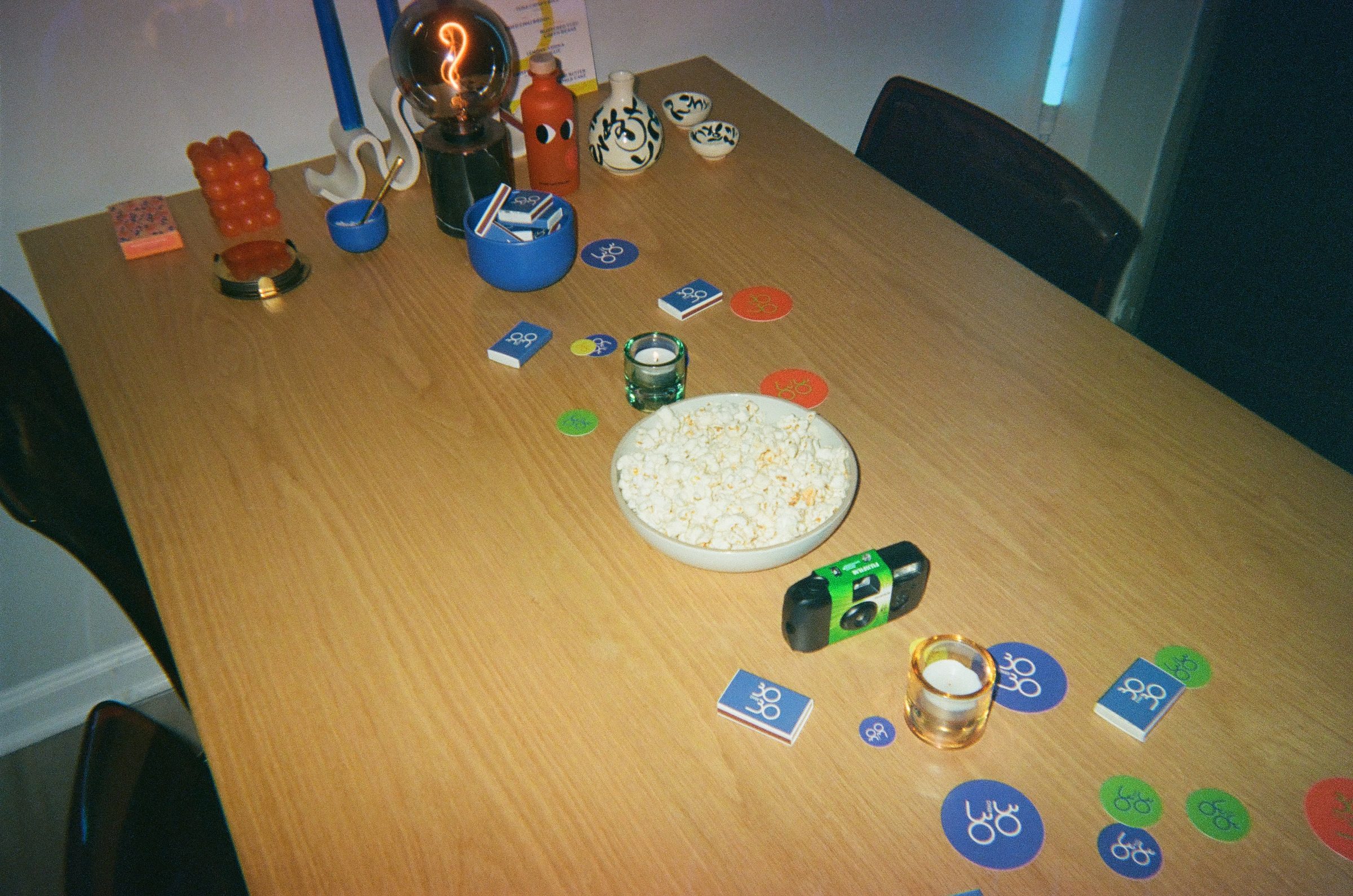 30 Over 30 table setting with branded stickers and matchbooks